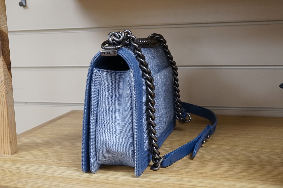 A Chanel denim cheveron flap shoulder bag with silver hardware, date code 20845697, 28cm wide